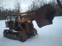Buldozers ar frontālo iekrāvēju CAT HT4